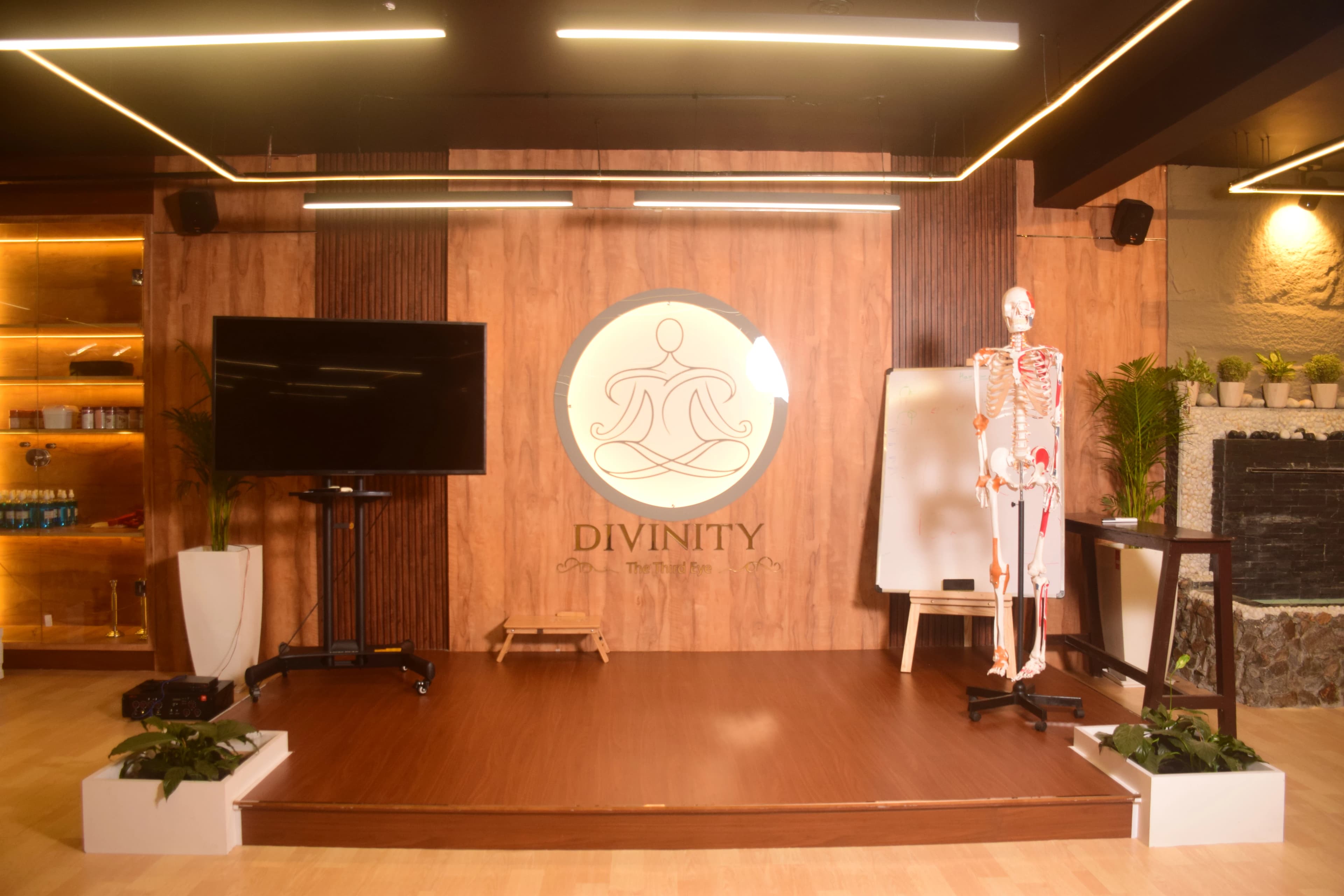 The practice hall, set beneath the studio's lotus emblem